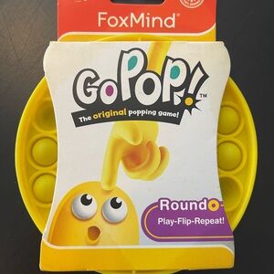 Bright Yellow Puzzle Game with Circular Indentations